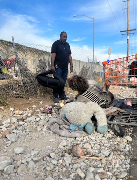 Shane O’Garro speaking with a person during homelessness outreach in San Diego